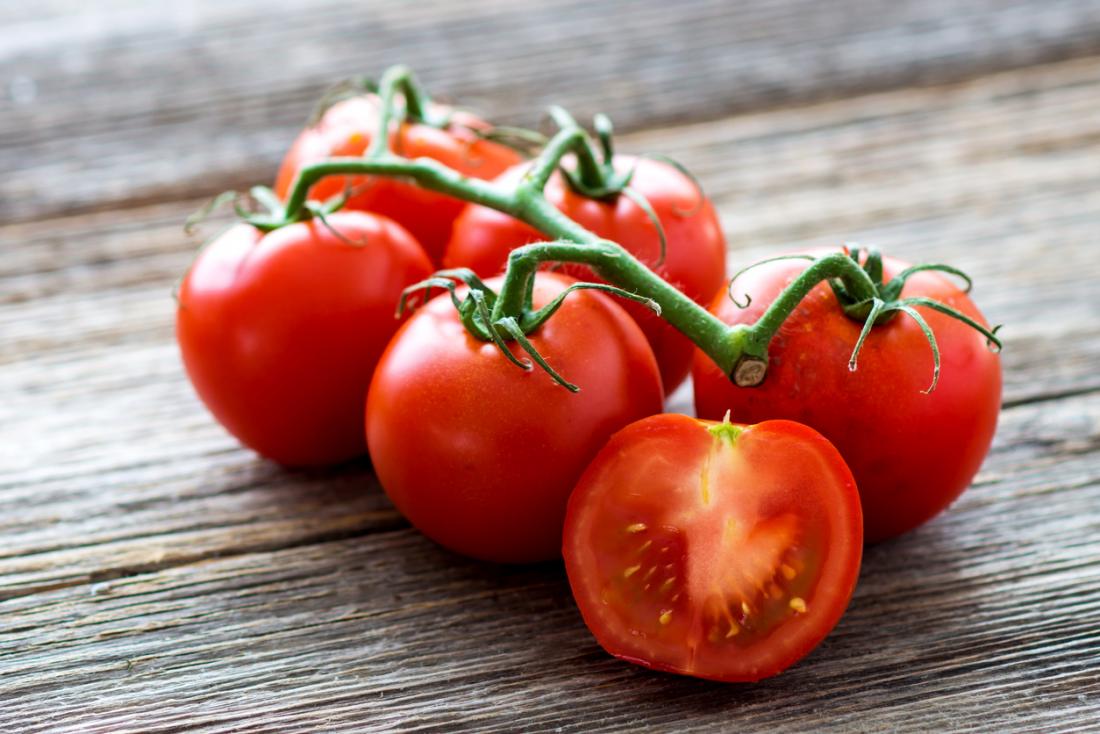 tomatoes on a wooden board